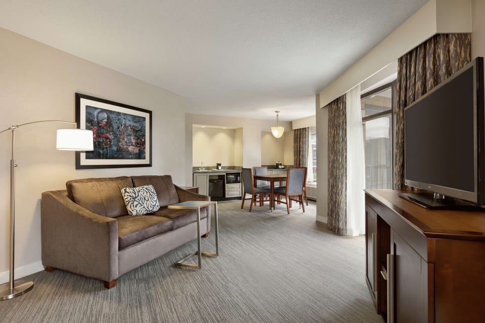 Suite, 1 King Bed, Non Smoking | Hypo-allergenic bedding, down comforters, desk, iron/ironing board