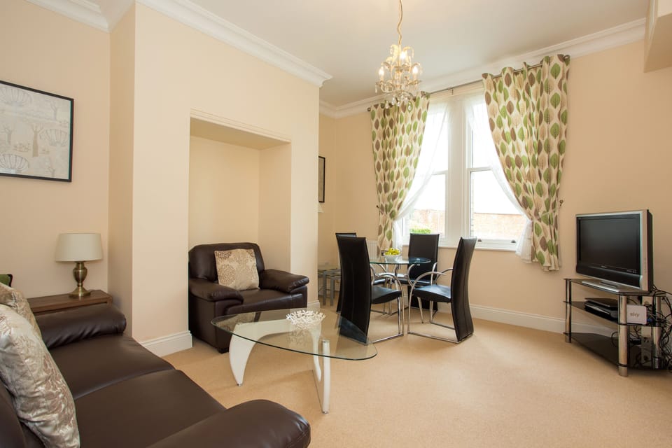 Premium Apartment, 2 Bedrooms | Living room | Flat-screen TV