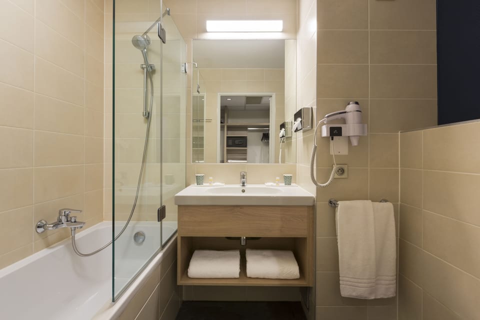 Eco-friendly toiletries, hair dryer, towels