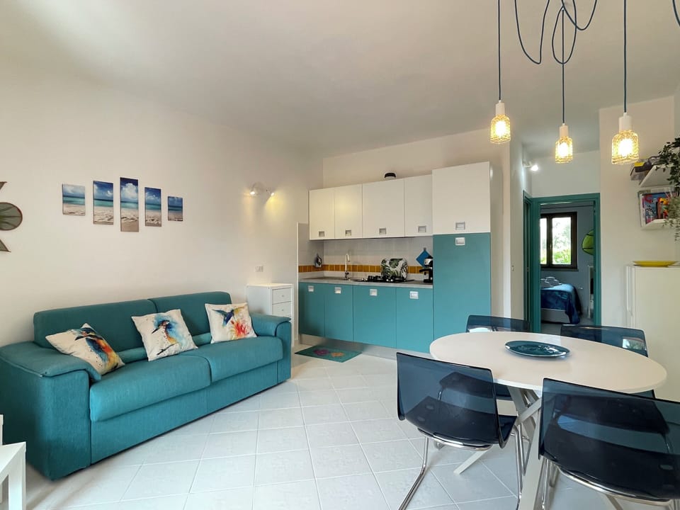 Apartment, 1 Bedroom | Living area | Flat-screen TV, toys