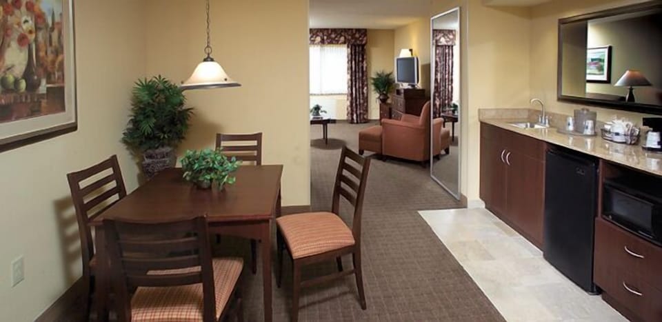 Suite, One King Bed | Private kitchen | Fridge, microwave, coffee/tea maker