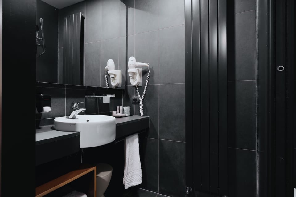 Shower, free toiletries, hair dryer, slippers