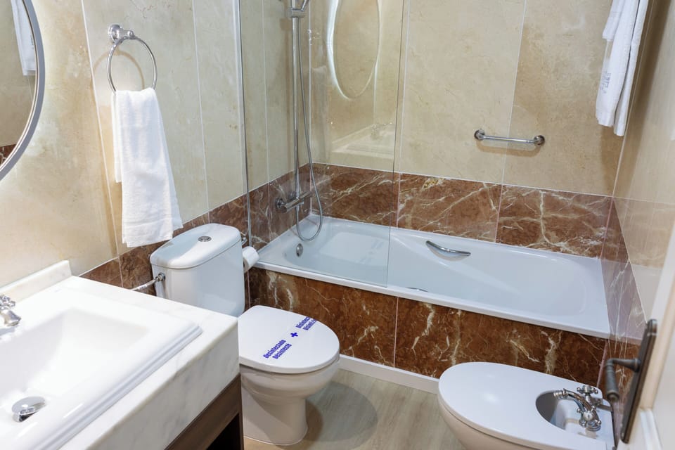 Hair dryer, towels, soap, toilet paper