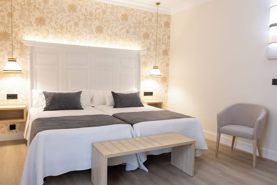 Twin Room | Minibar, in-room safe, desk, iron/ironing board (on request)
