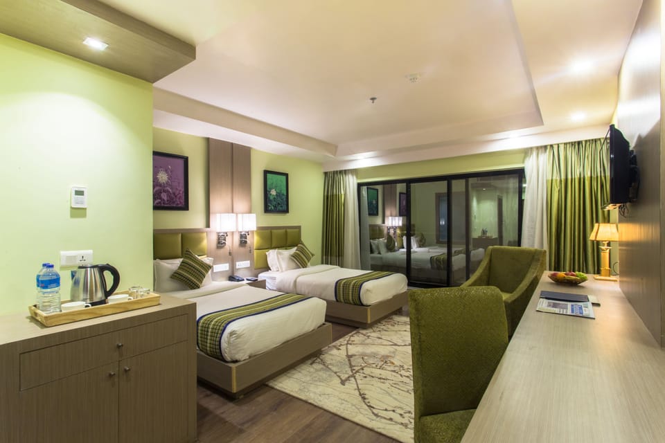 Deluxe Room, 1 Bedroom, City View | Soundproofing, iron/ironing board, rollaway beds, free WiFi
