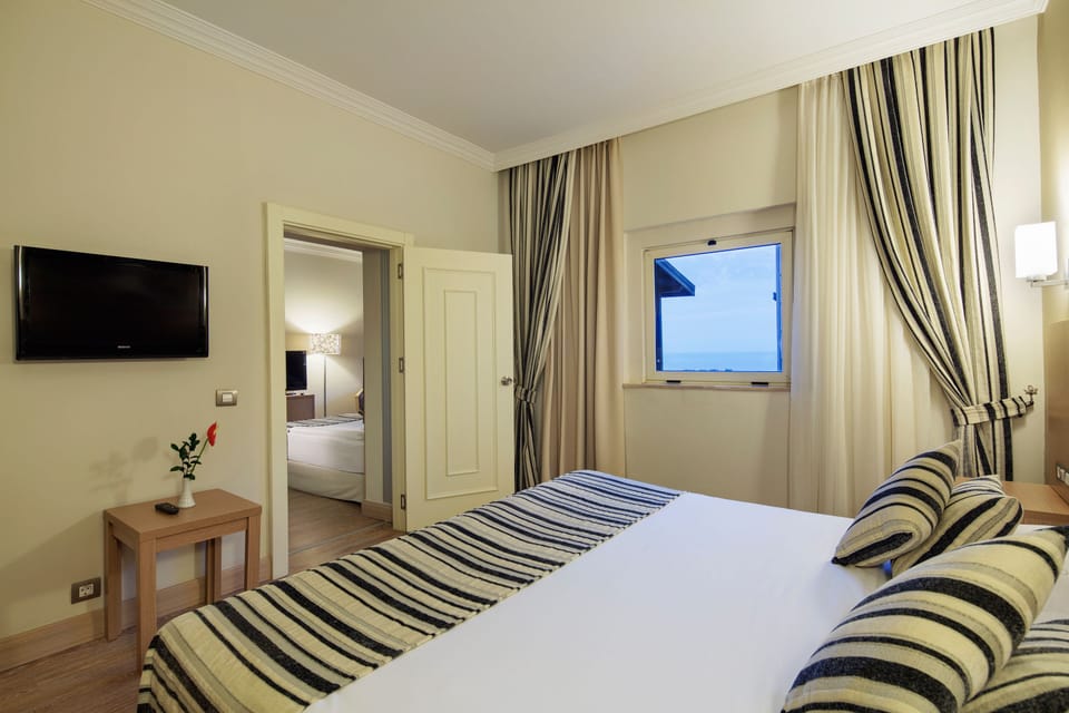 Family Room, 2 Bedrooms | Premium bedding, minibar (free items), in-room safe, desk