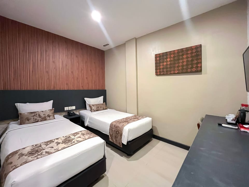 Economy Room | Blackout drapes, WiFi (free), bed sheets