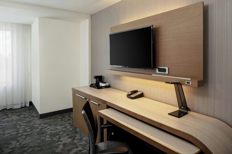 Desk, laptop workspace, blackout drapes, iron/ironing board