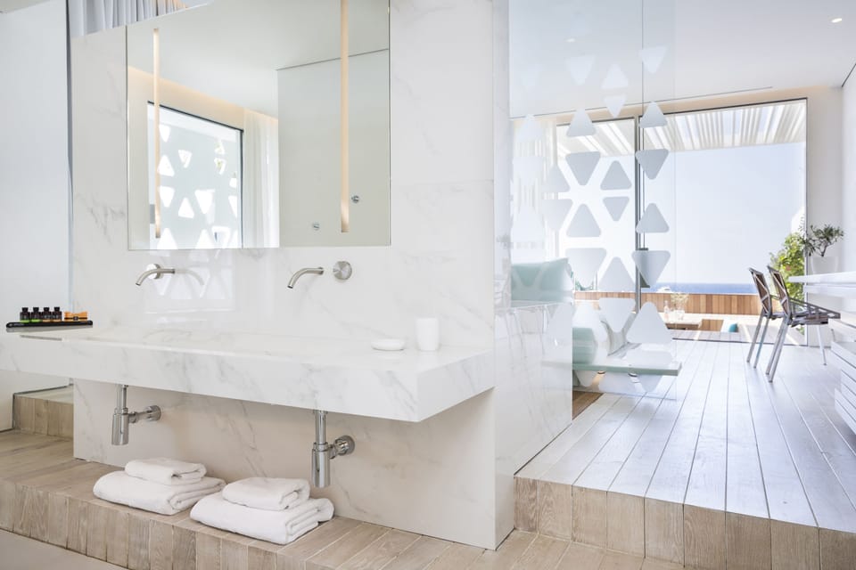 Shower, rainfall showerhead, designer toiletries, hair dryer