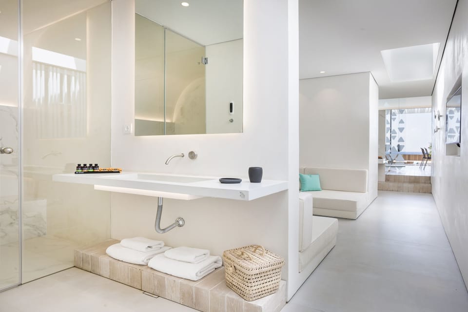 Shower, rainfall showerhead, designer toiletries, hair dryer