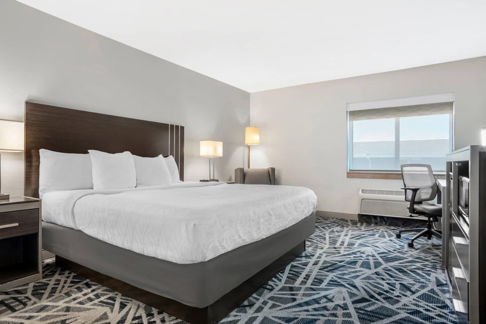 Suite, 1 King Bed with Sofa bed, Non Smoking | Desk, laptop workspace, blackout drapes, iron/ironing board