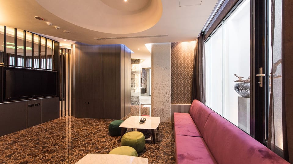 Deluxe Double Room | Living area | Flat-screen TV