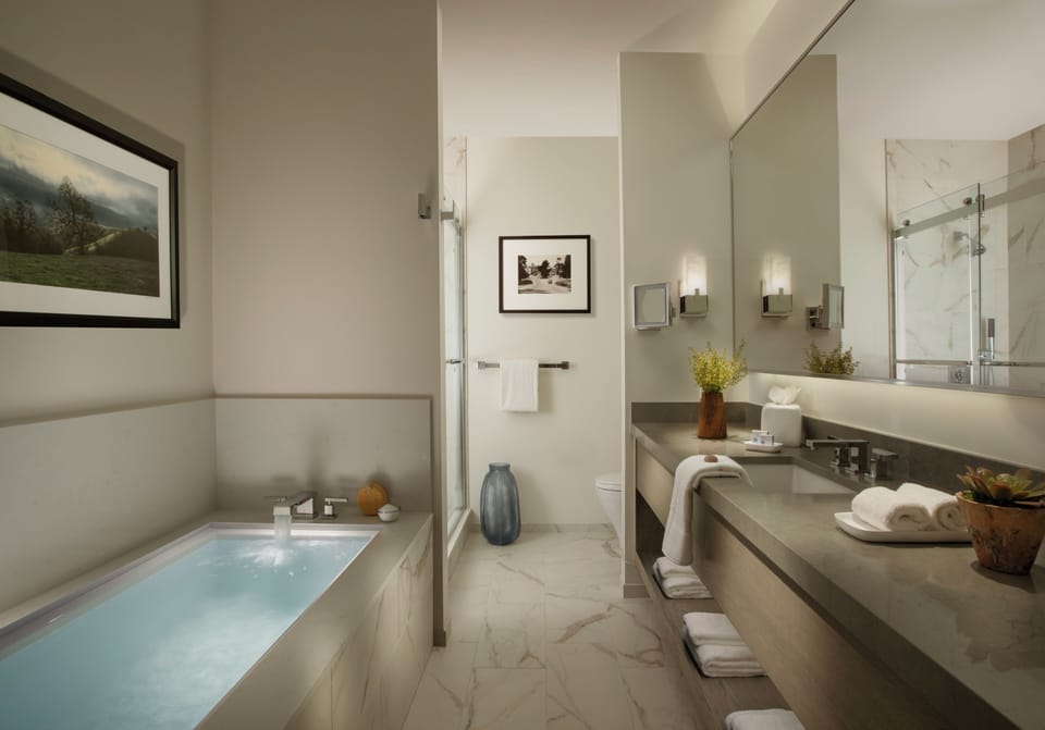 Carmel Bay Suite | Bathroom | Designer toiletries, hair dryer, bathrobes, towels