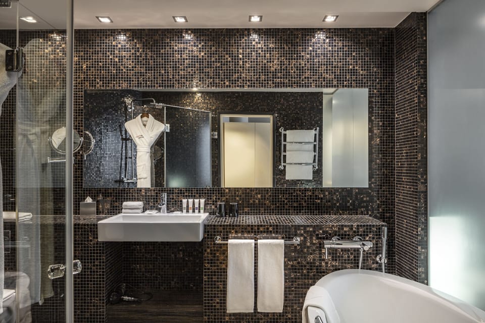 Designer toiletries, hair dryer, bathrobes, slippers