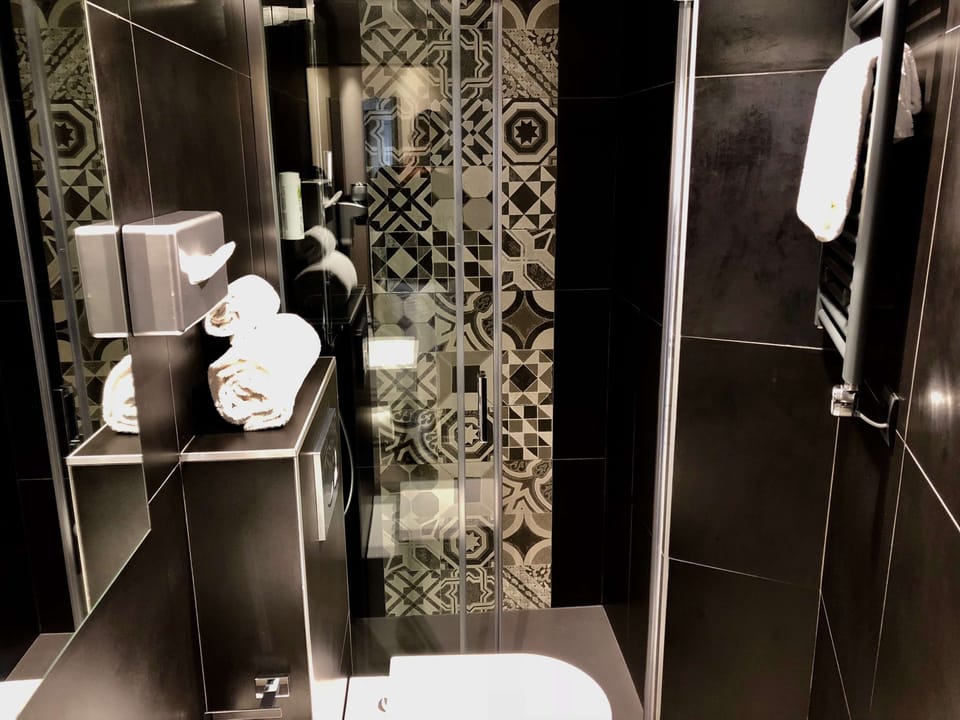 Designer toiletries, hair dryer, towels, soap