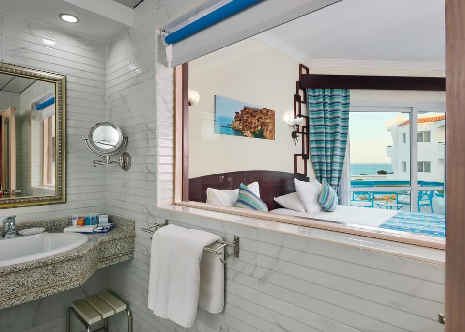 Superior Pool View Room | Minibar, in-room safe, blackout drapes, iron/ironing board