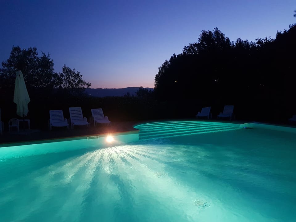 Outdoor pool, pool umbrellas, sun loungers