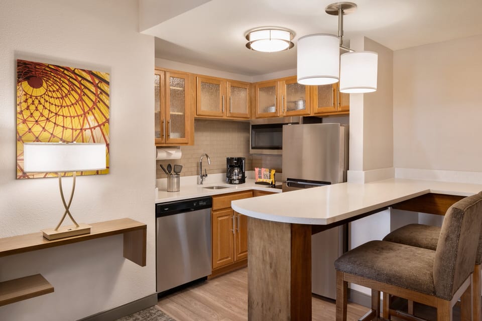 Full-size fridge, microwave, stovetop, dishwasher