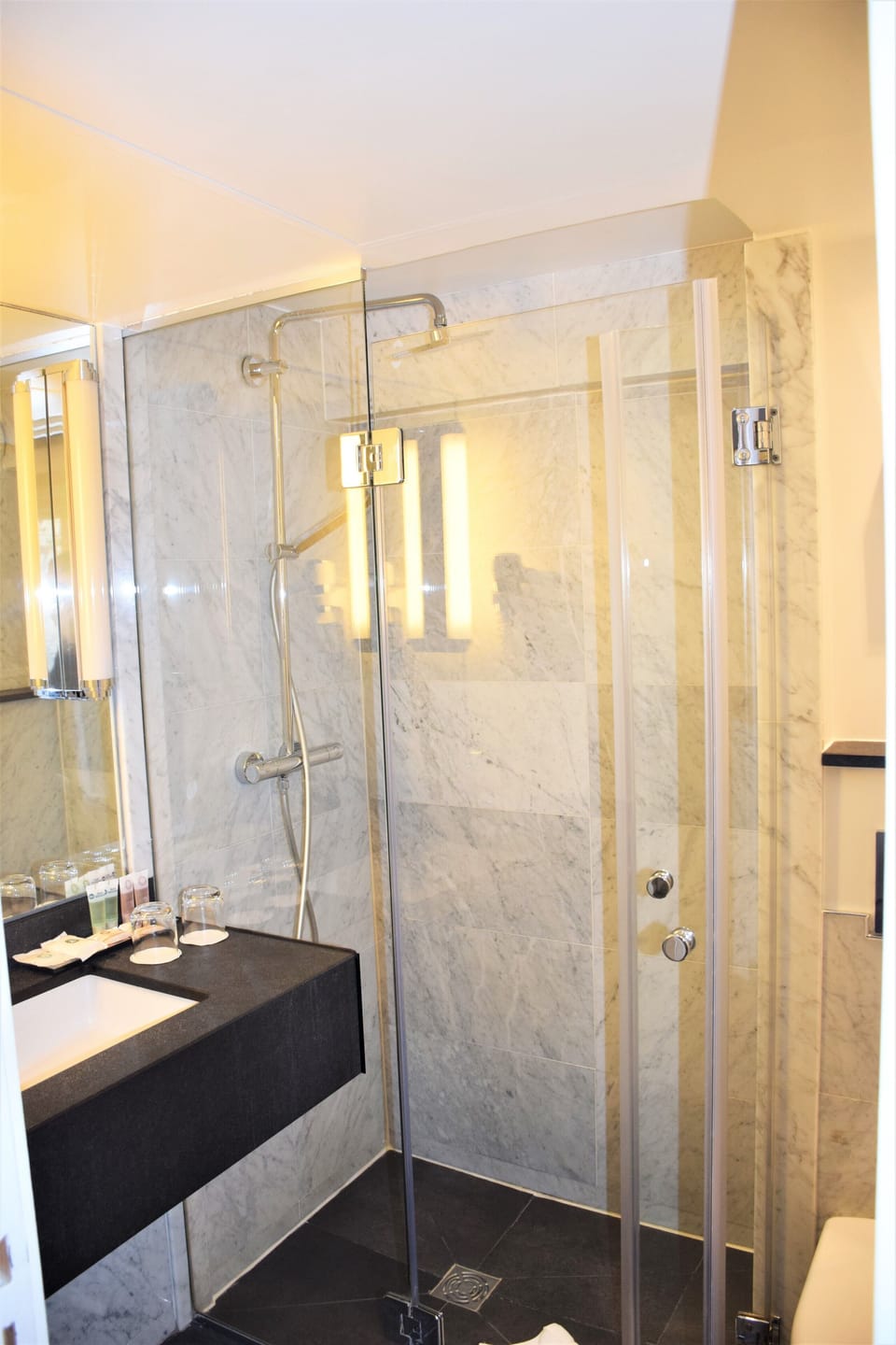 Shower, rainfall showerhead, hair dryer, towels