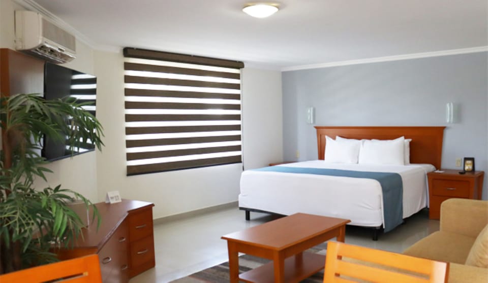 Junior Room | Desk, laptop workspace, blackout drapes, soundproofing