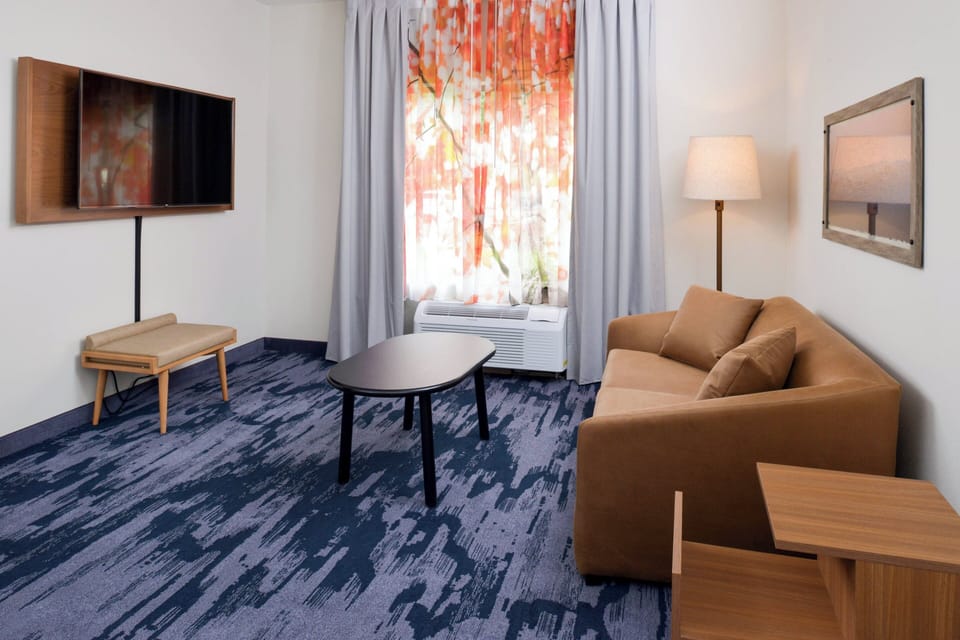 Suite, Multiple Beds | Living area | 55-inch flat-screen TV with satellite channels, TV, Netflix