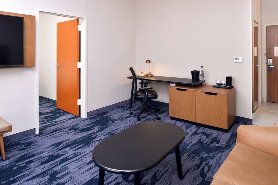 Suite, 1 Bedroom | Living area | 55-inch flat-screen TV with satellite channels, TV, Netflix