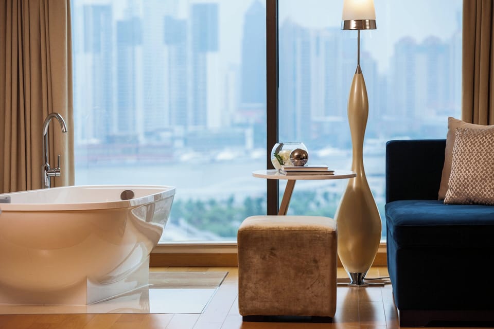 Bund River View Studio | Bathroom | Combined shower/tub, hair dryer, bathrobes, slippers
