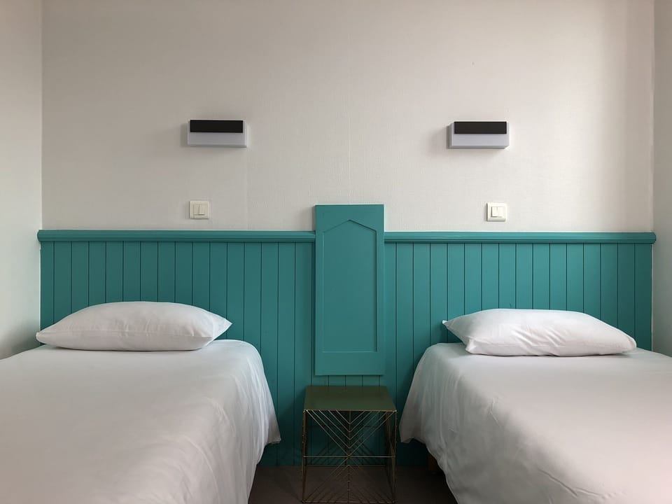 Twin Room | Desk, blackout drapes, free cribs/infant beds, free WiFi