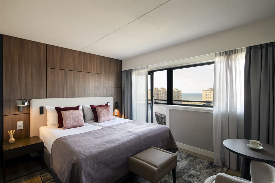 Deluxe Room, Sea View | Premium bedding, in-room safe, desk, iron/ironing board