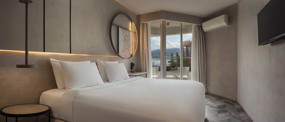 Room, Partial Sea View | Premium bedding, minibar, in-room safe, blackout drapes