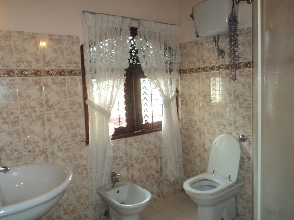 Shower, free toiletries, slippers, towels