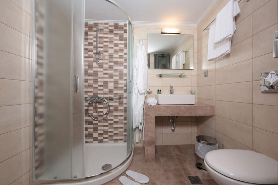 Shower, free toiletries, hair dryer, slippers