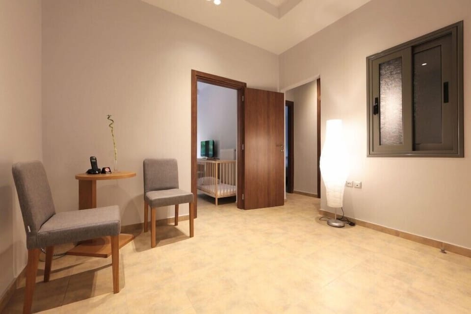 Standard Apartment, 2 Bedrooms | Living area | 30-inch flat-screen TV with cable channels, TV, Netflix