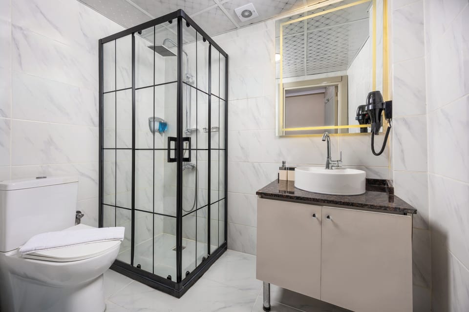 Shower, free toiletries, hair dryer, slippers