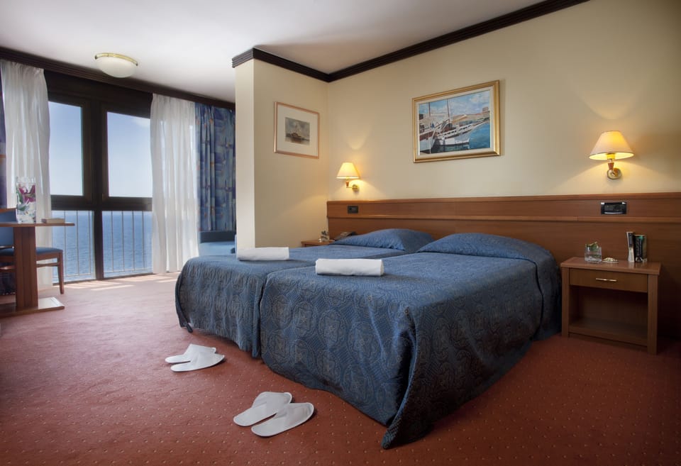 Double or Twin Room, Sea View | 1 bedroom, minibar, in-room safe, desk