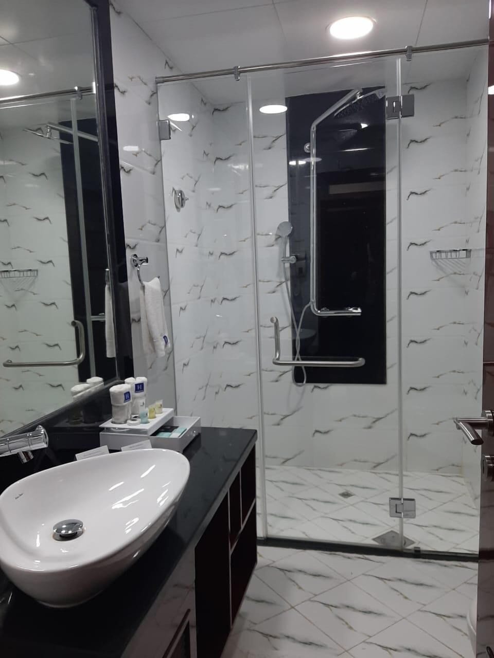 Shower, rainfall showerhead, eco-friendly toiletries, hair dryer