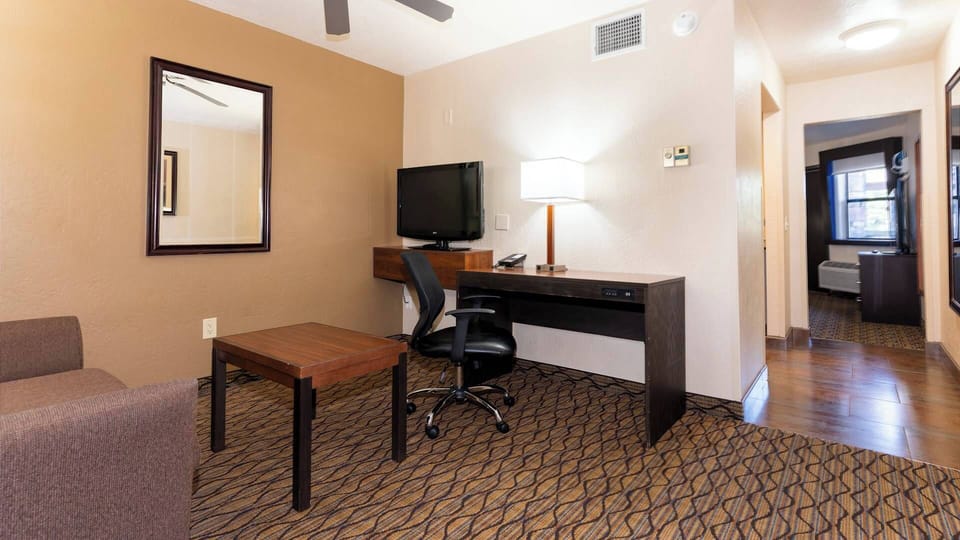 1 Bedroom King bed Suite | Living area | 32-inch TV with satellite channels
