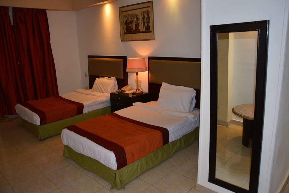 Standard Double or Twin Room | In-room safe, blackout drapes, iron/ironing board, rollaway beds