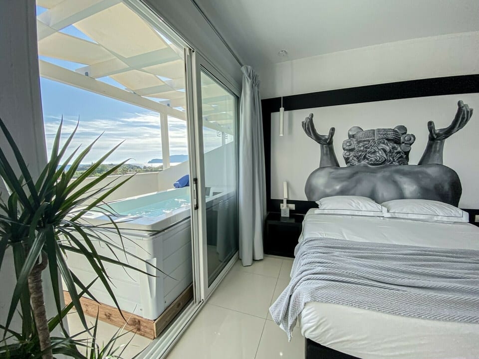 Superior Suite, Hot Tub | 1 bedroom, pillowtop beds, minibar, in-room safe