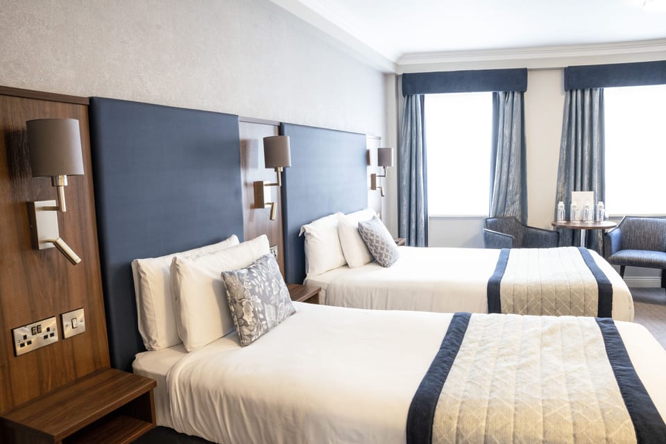 Quadruple Room | Desk, iron/ironing board (on request), cribs (free), WiFi (free)