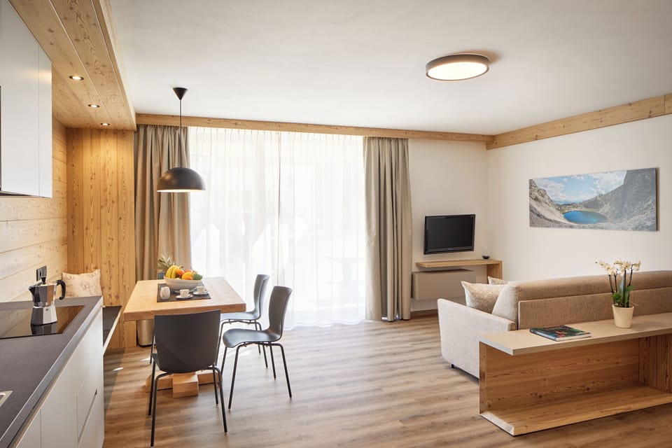 Superior Condo | Living area | 20-inch flat-screen TV with satellite channels, TV, heated floors