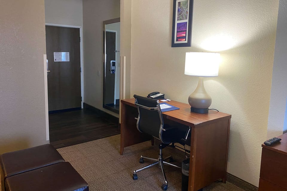 Suite, 1 King Bed, Non Smoking | Desk, laptop workspace, blackout drapes, iron/ironing board