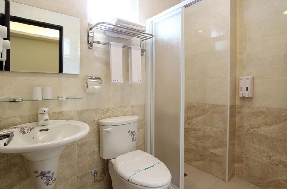 Shower, free toiletries, hair dryer, slippers