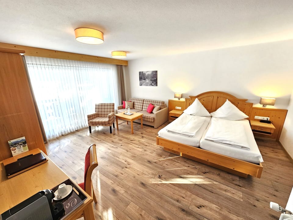 Comfort Quadruple Room, Balcony, Mountain View | Minibar, in-room safe, blackout drapes, soundproofing
