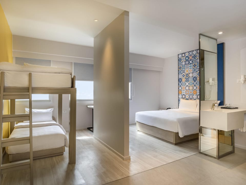 Family Double Room, Multiple Beds | Minibar, in-room safe, desk, blackout drapes