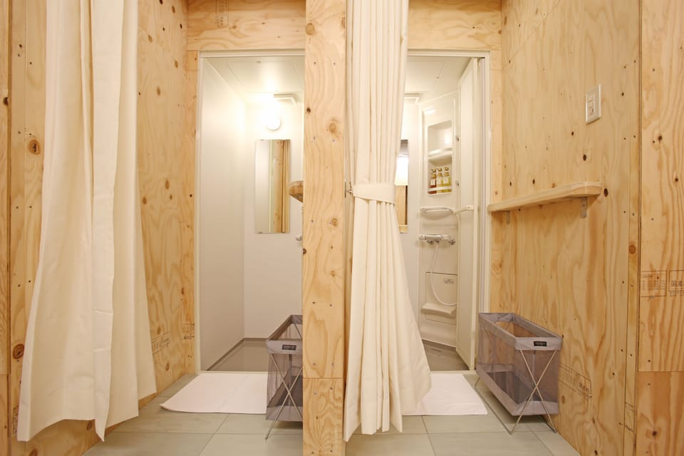 Shower, free toiletries, slippers, towels