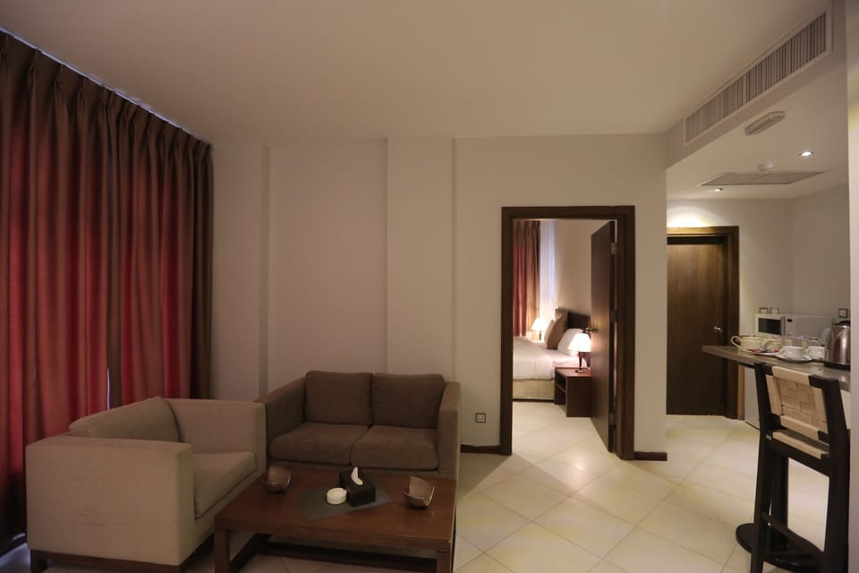 Executive Apartment, 1 Bedroom, Kitchenette, City View | Living room | 32-inch flat-screen TV with satellite channels, TV