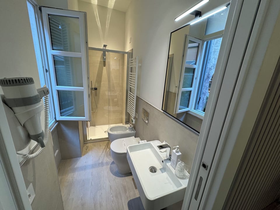 Shower, rainfall showerhead, eco-friendly toiletries, hair dryer
