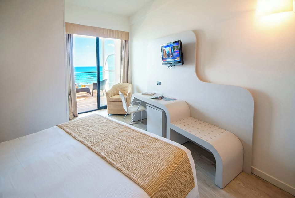 Executive Double or Twin Room, Sea View | Minibar, in-room safe, desk, blackout drapes