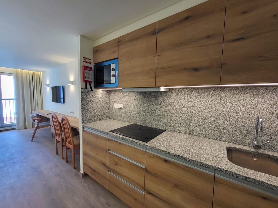 Desk, blackout drapes, soundproofing, iron/ironing board